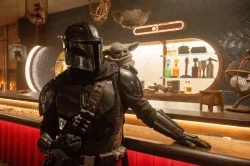 STAR WARS: THE MANDALORIAN AND GROGU, from left: Pedro Pascal, Grogu, 2026. ph: Nicola Goode / © Walt Disney Studios Motion Pictures / Courtesy Everett Collection