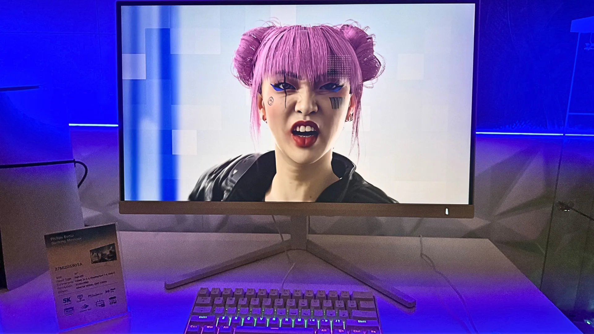 Philips monitor displaying a person with pink hair and futuristic makeup.