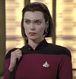 Ensign Ro in the transporter room of the Enterprise