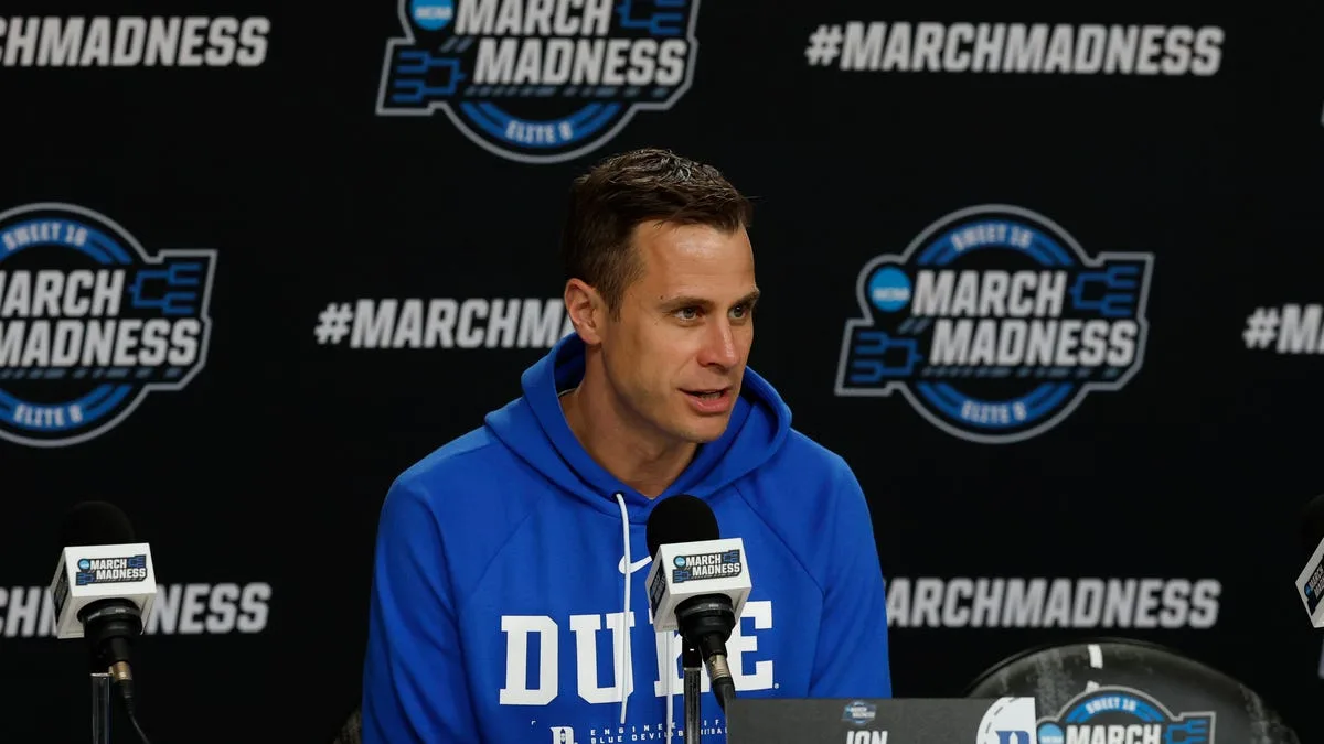 Duke coach at a press conference. Duke basketball games will be streamed on Amazon Prime Video.