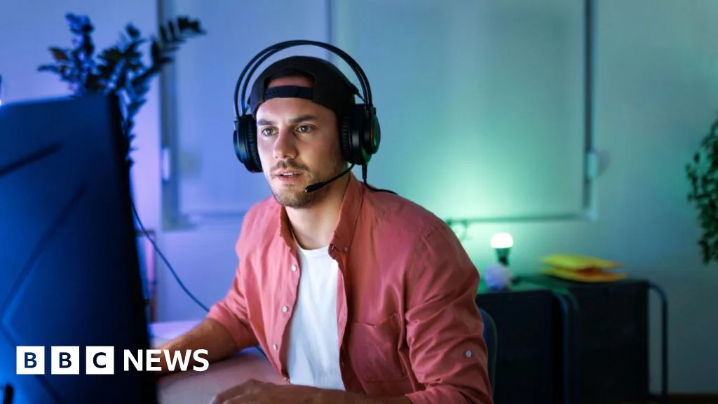 Gamer wearing headset focused on screen, representing FAA's recruitment of gamers.