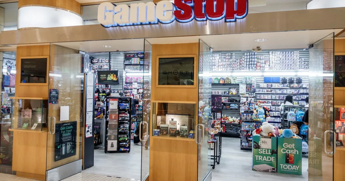 Inside a GameStop store. Games and merchandise are visible.